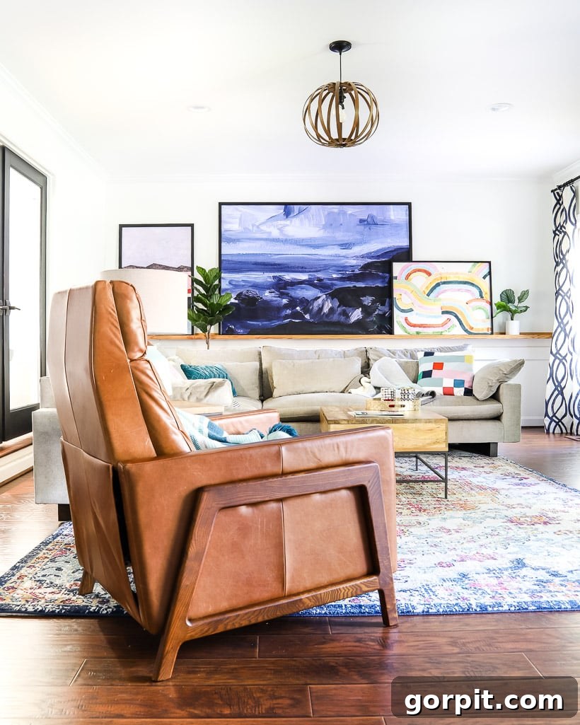West Elm Spencer Recliner: Our Honest 5-Year Ownership Report 5 leather West Elm Spencer recliner in colorful family room