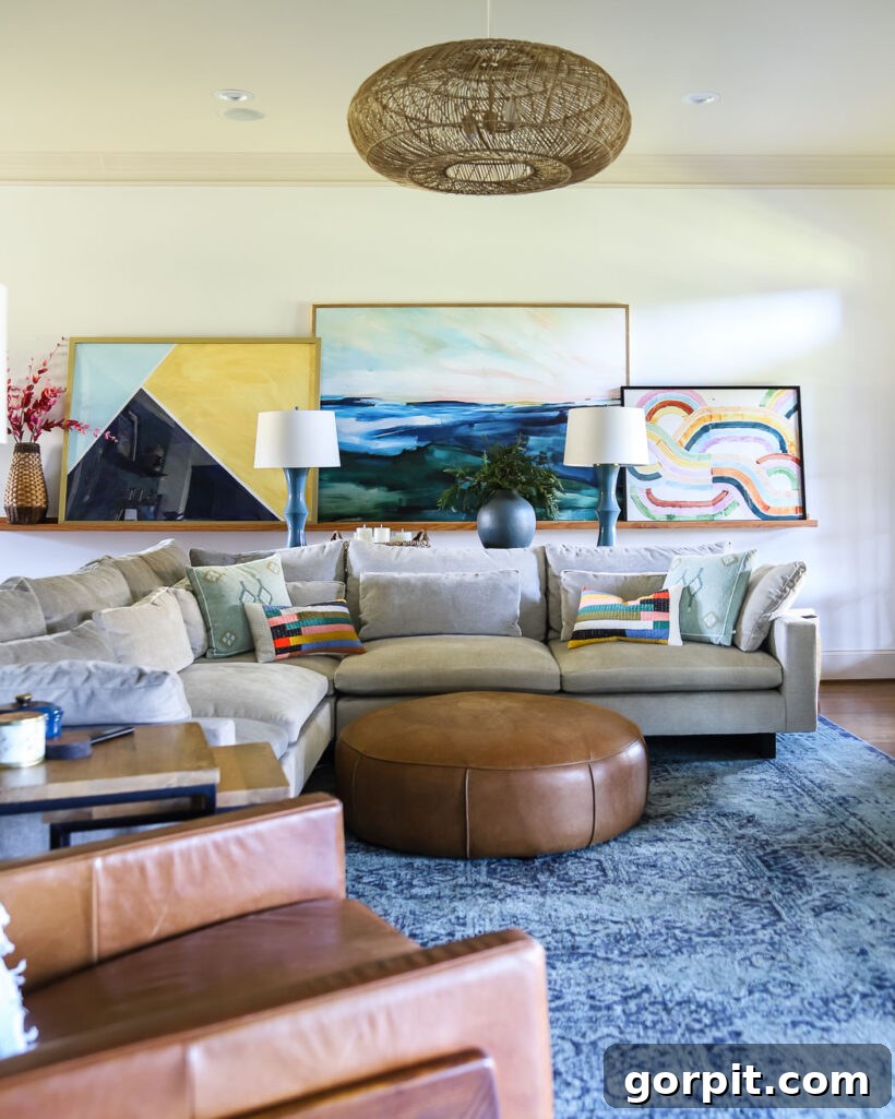 Effortless Budget DIY Canvas Frame 5 colorful family room with large canvas art surrounded by DIY frame, after framing