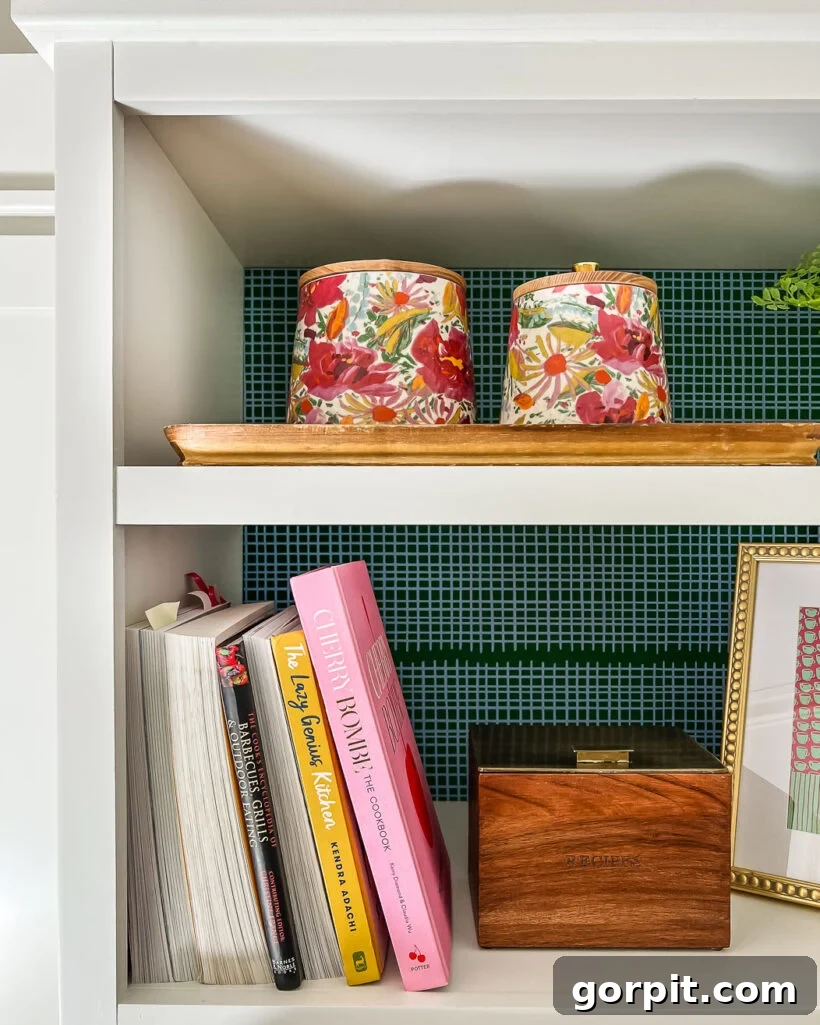 Close-up of the colorful wallpaper accent in the butler's pantry, behind a shelf.
