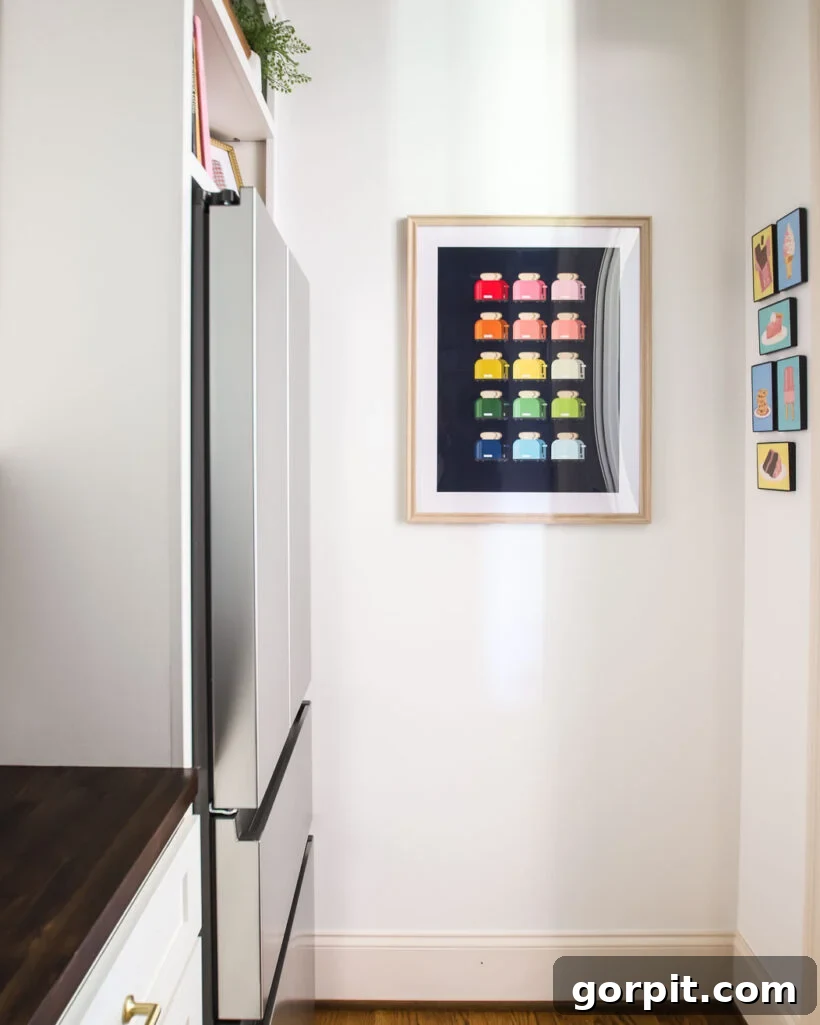Butler's pantry with personal colorful artwork, paint-by-number postcards, displayed near the doorway.