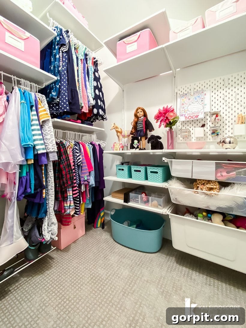 Transform Your Closets: 7 DIY Makeovers Using Our Favorite Systems 2 The corner of a large walk-in closet features an IKEA Boaxel closet system in kid's closet full of bright clothes and baskets for toys.