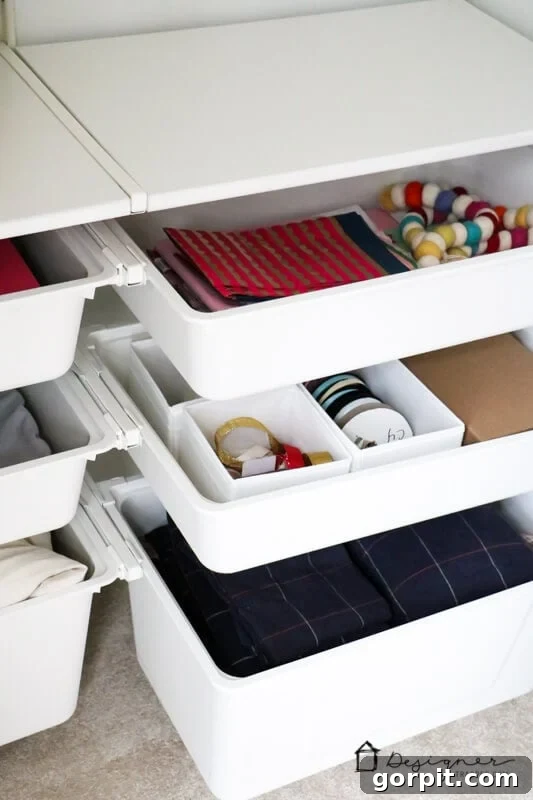 Transform Your Closets: 7 DIY Makeovers Using Our Favorite Systems 13 A close-up of IKEA drawer bins installed in a bedroom closet and filled with accessories and clothes.