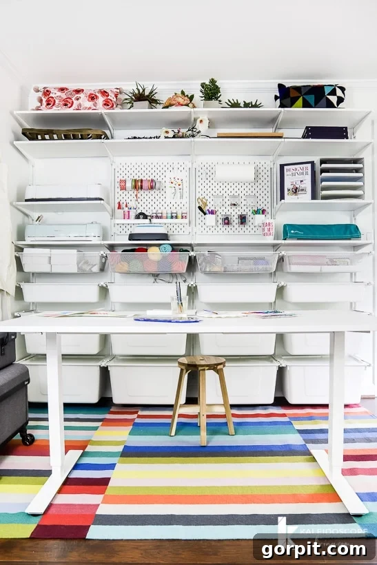 Transform Your Closets: 7 DIY Makeovers Using Our Favorite Systems 16 An IKEA Boaxel closet system dominates the back wall of a craft room. A long table is in front of the organized craft supplies.