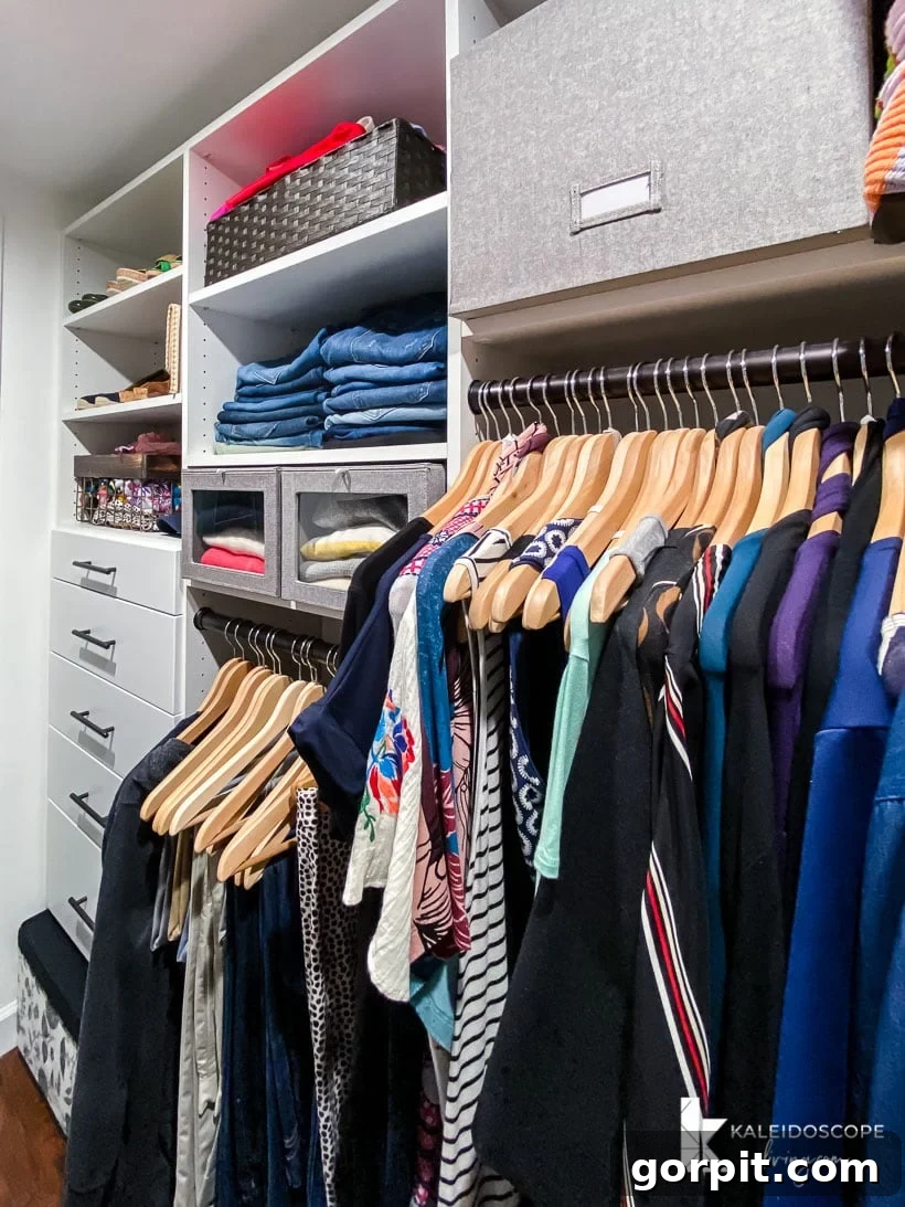 Transform Your Closets: 7 DIY Makeovers Using Our Favorite Systems 4 One side of the primary bedroom closet has organized hanging clothes on different levels, drawers, and shelves using the EasyCloset system.