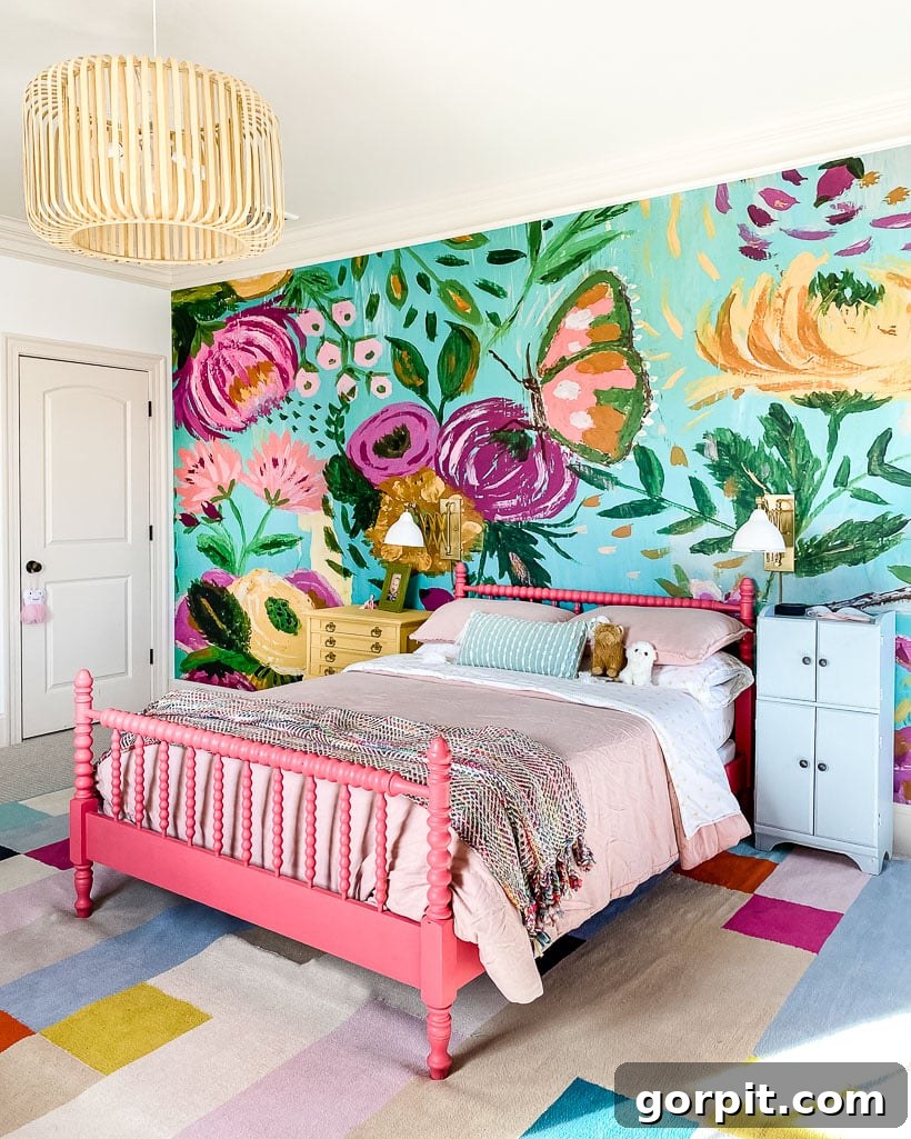 18 Wallpaper Gems to Transform Your Digital Space 9 A whimsical girl's room featuring a vibrant wallpaper mural depicting a garden scene, complemented by a painted bed, creating a dreamy and inspiring space.