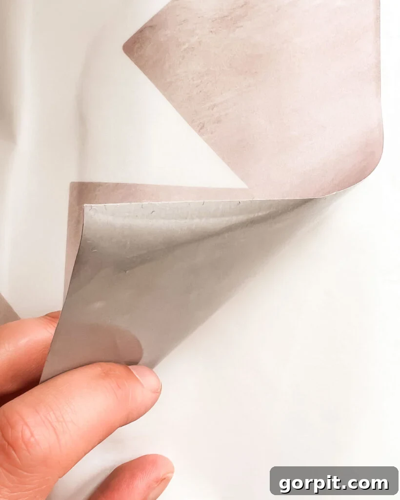 Tile Stickers: The Ultimate Guide 3 close up of tile stickers being peeled off paper backing