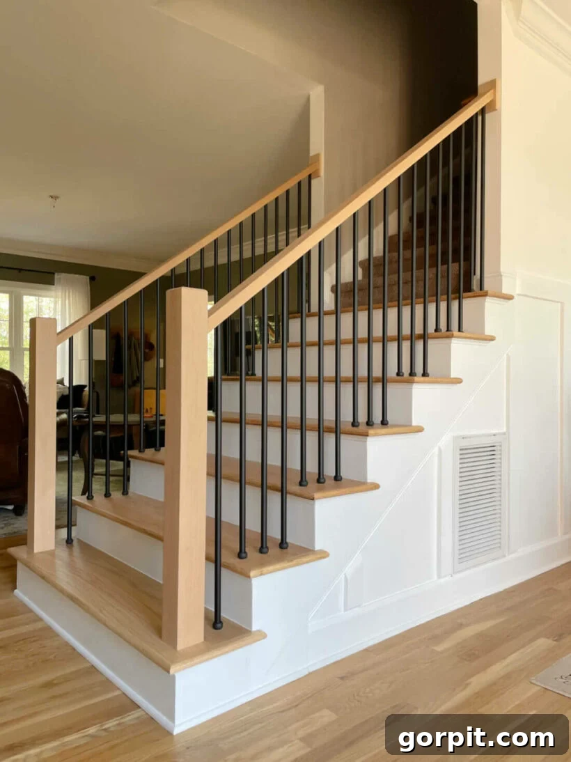 Creative DIY Staircase Transformations 15 modern staircase makeover changing the lines of the bottom step and bannister