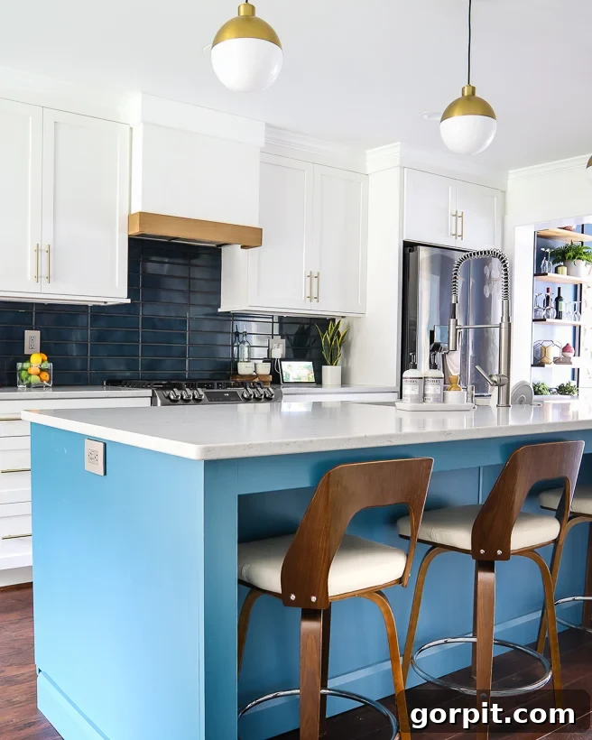 Timeless Neutral Colors for Stunning Kitchen Cabinets 4 Sherwin Williams Pure White kitchen cabinets with Silken Peacock blue island