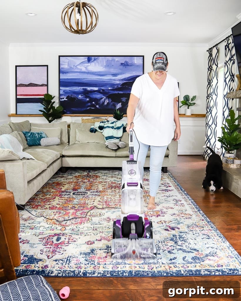 Mastering Area Rug Cleaning: Expert Techniques 2 woman cleaning area rug with Hoover carpet cleaner