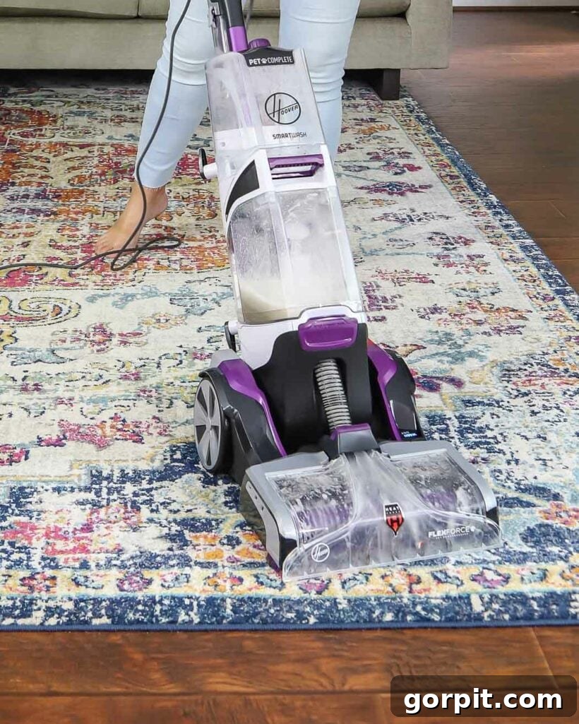 Mastering Area Rug Cleaning: Expert Techniques 5 woman using Hoover SmartWash Carpet Cleaner on area rug
