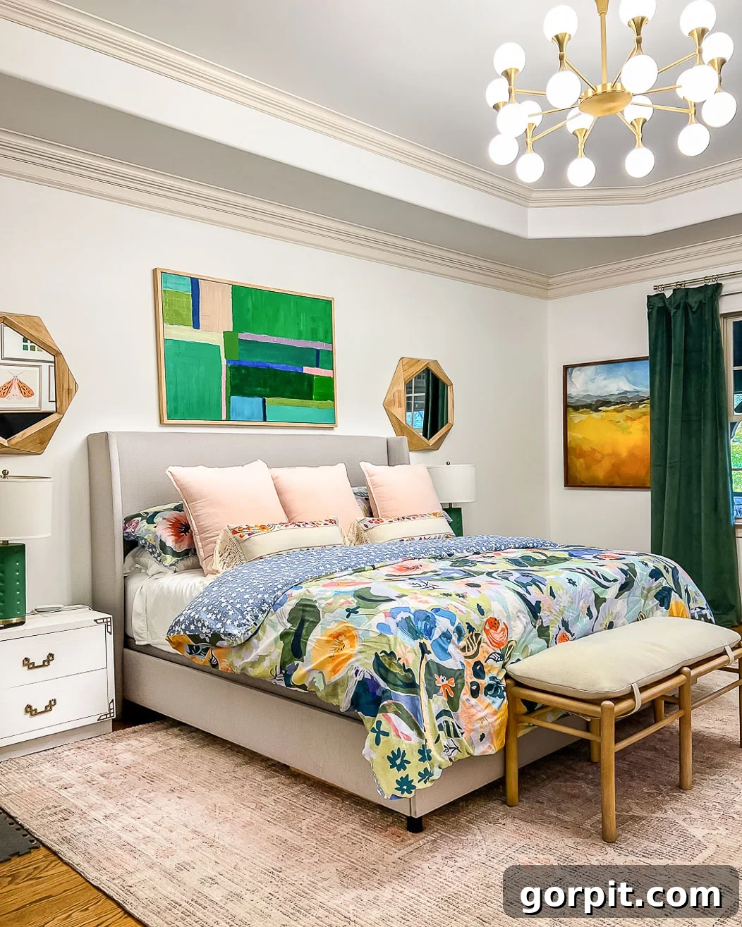 A 9 x 12 West Elm affordable area rug under a king size bed in a colorful and tidy bedroom, adding softness and design.