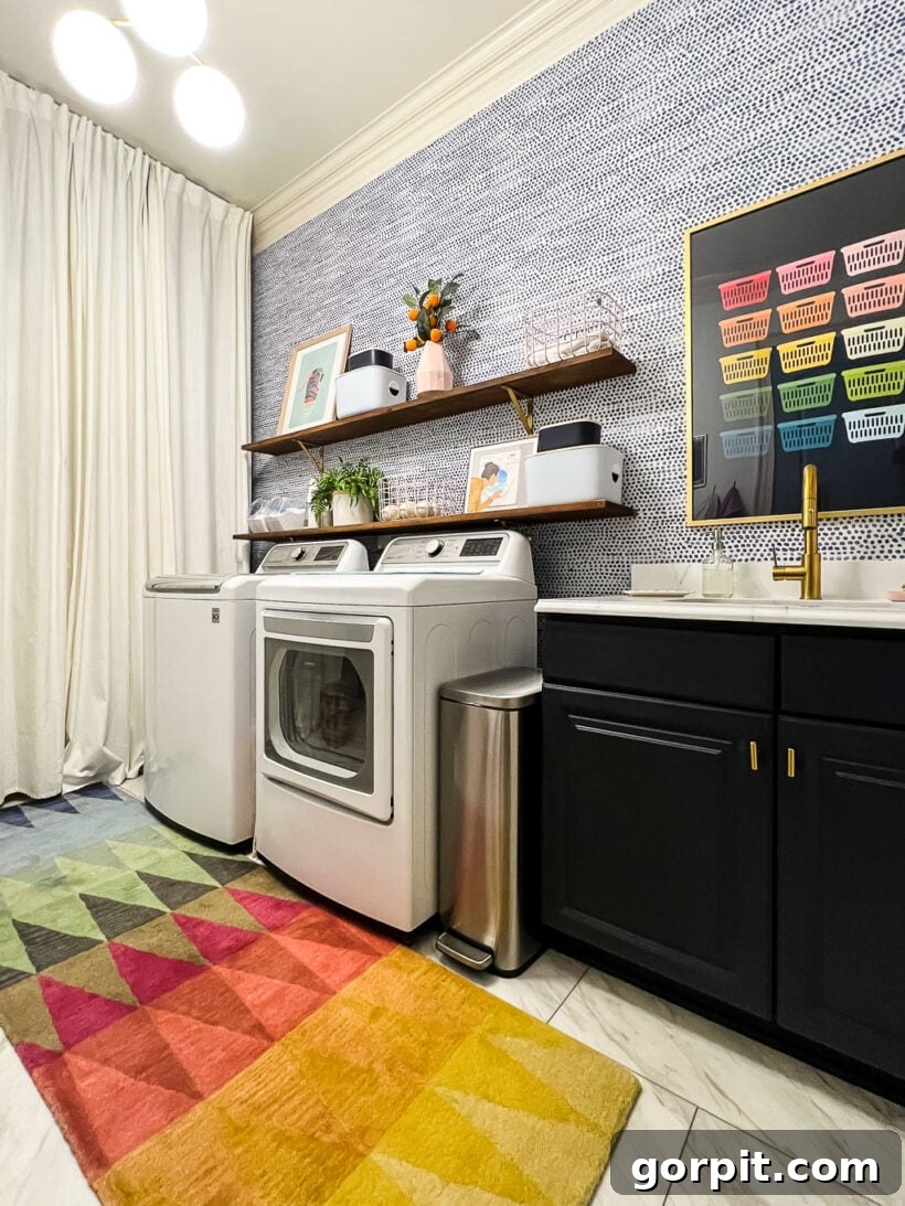 A brightly colored geometric affordable area rug in a laundry room, sourced from Overstock.