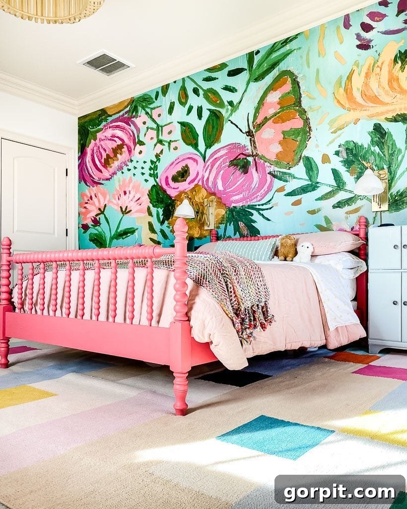 Elevate Your Interiors Innovative Accent Wall Designs 2 A floral mural accent wall behind a pink bed by Tasha Agruso of Kaleidoscope Living, creating a stunning focal point in a vibrant bedroom.