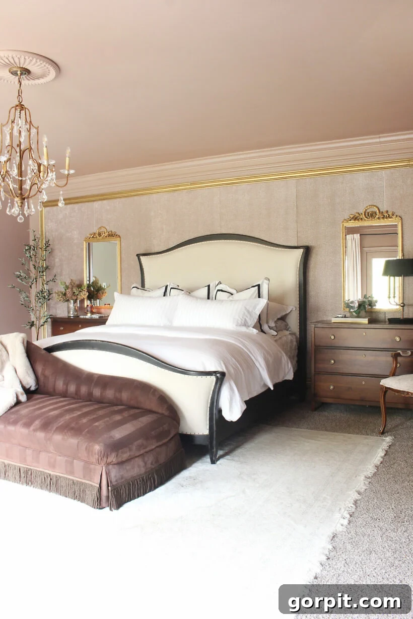 Elevate Your Interiors Innovative Accent Wall Designs 21 A chic and elegant bedroom with a glass chandelier uses an upholstered headboard wall to create a focal point in the room, adding luxury and comfort.