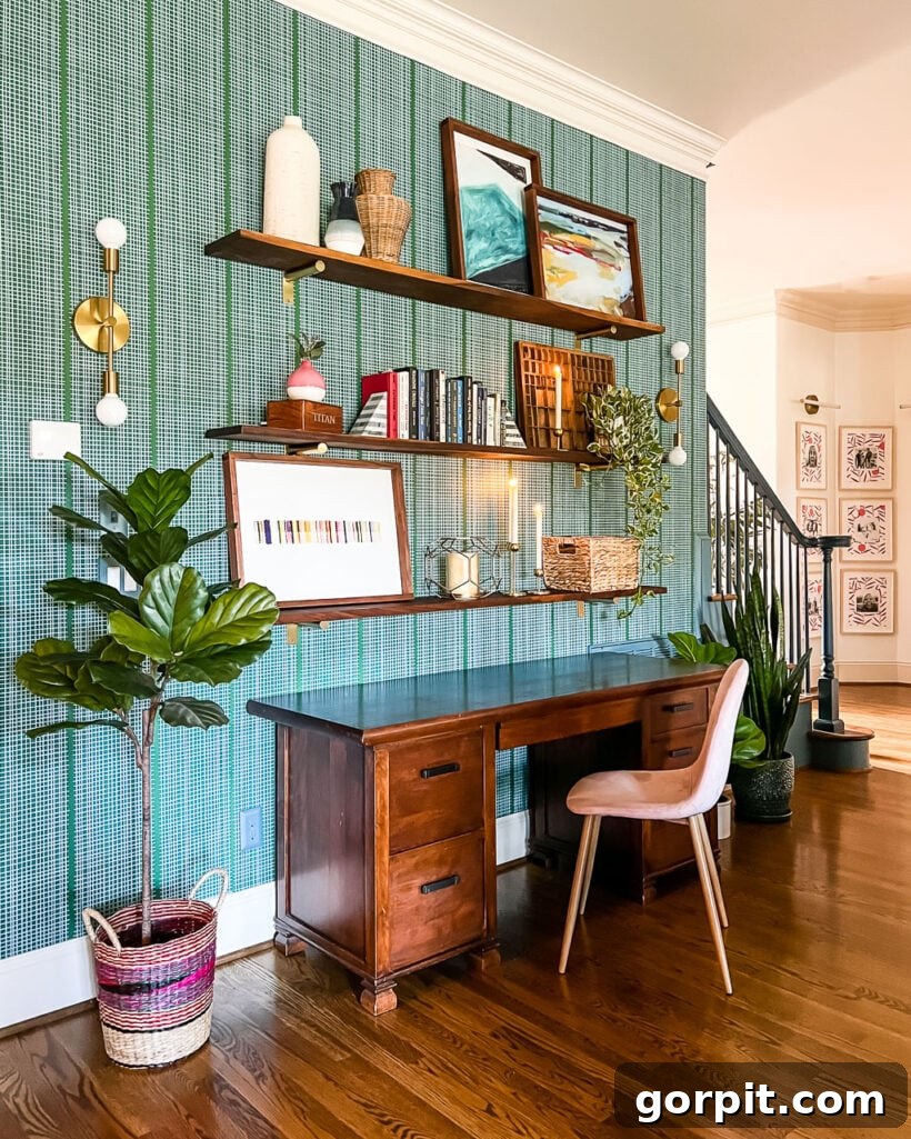 Elevate Your Interiors Innovative Accent Wall Designs 6 An accent wall idea comes to life with green checkered renter-friendly wallpaper, complemented by a large potted plant, wooden shelves, and a modern desk, creating a stylish and adaptable workspace.