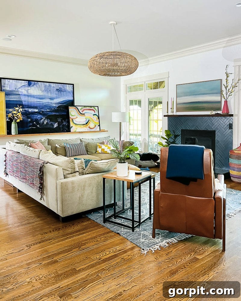 End Curling Rug Corners Smart Solutions for Every Home 3 colorful living room with tan sofa, large art on ledge, and blue and white rug on floor