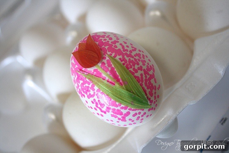 Sharpie Dot Art Easter Eggs 5 A dotted Easter egg with a sticker still attached, waiting for the paint to dry completely.