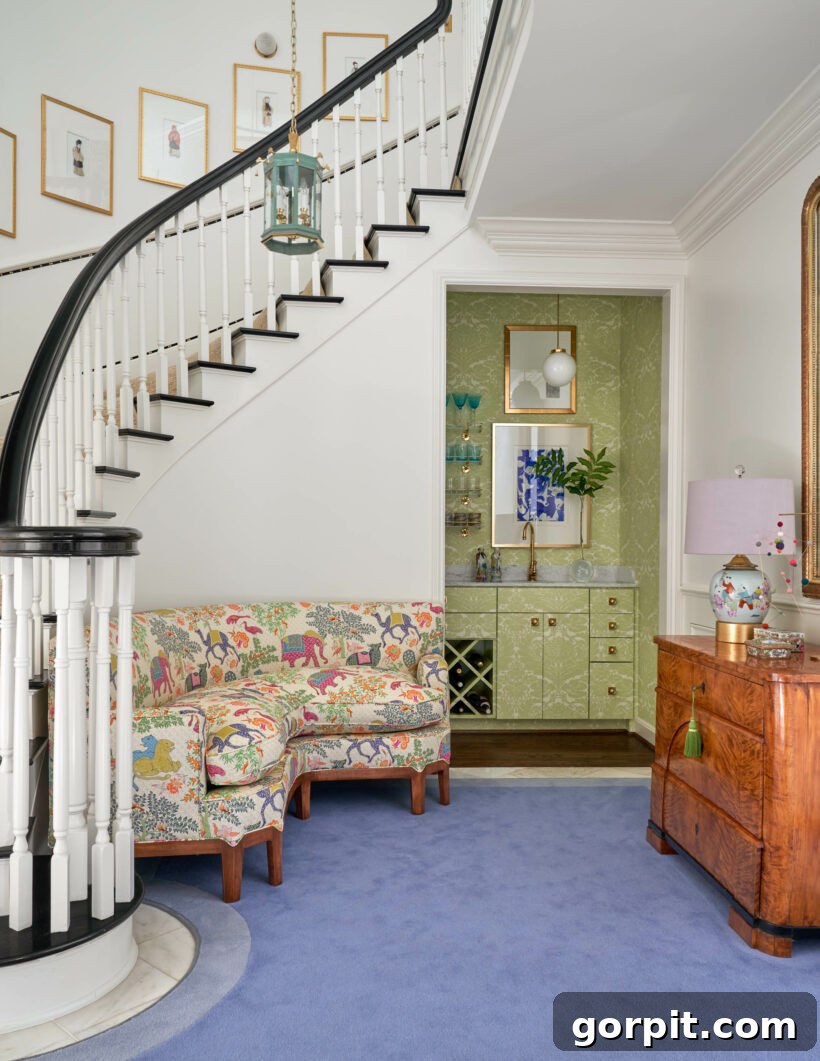 A vibrant living room with blue carpet features a sweeping spiral staircase with a black rail and white spindles, showcasing elegant design.
