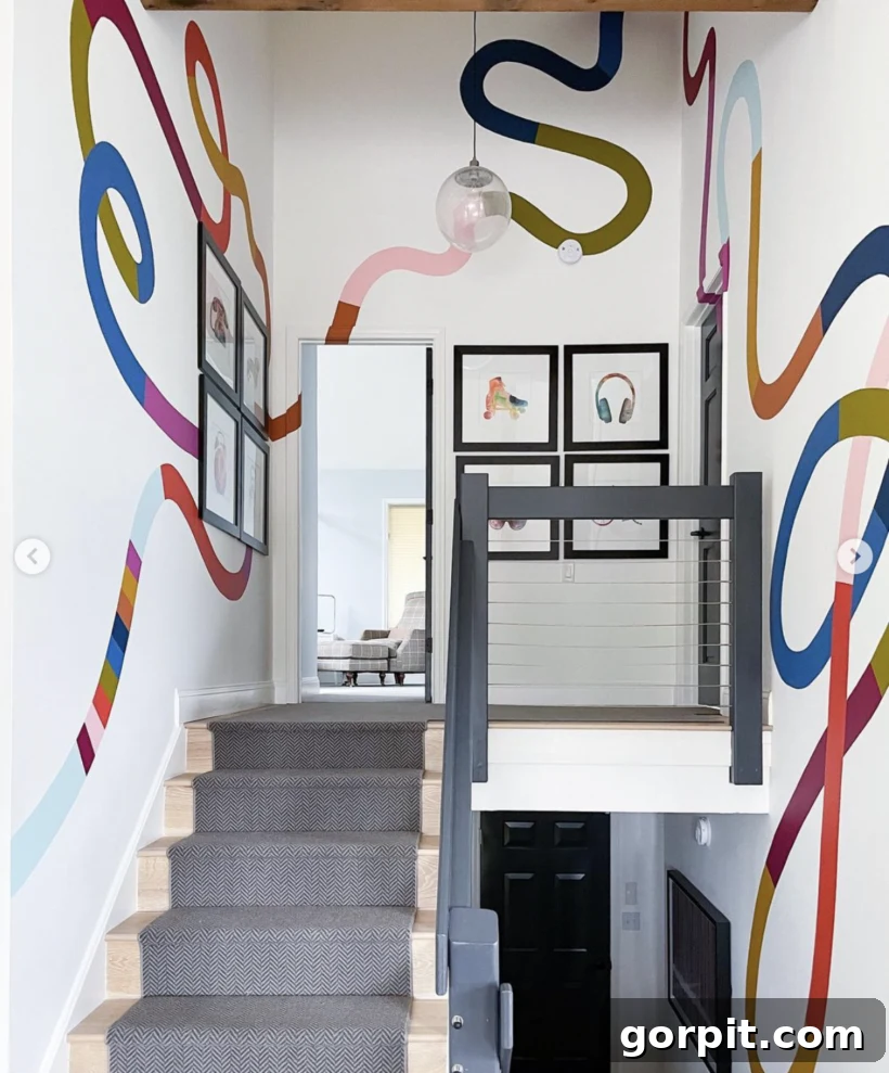 stairwell with a floor-to-ceiling color-blocked squiggle wall mural
