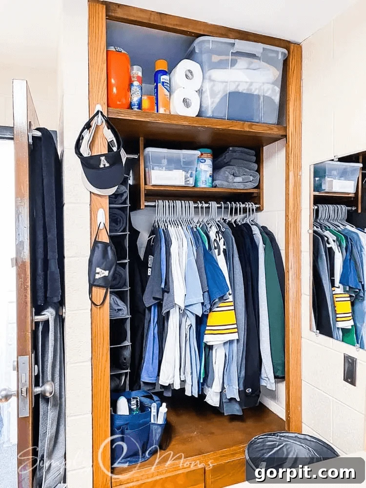 The Modern Guy's Dorm Room Playbook 9 A perfectly organized dorm room closet, showcasing smart storage solutions with shelves, drawers, and hanging organizers for maximum efficiency.