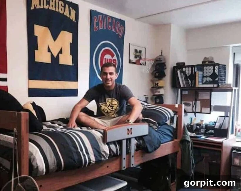 The Modern Guy's Dorm Room Playbook 10 A male student relaxing on his dorm room bed, with various flags hanging behind him, showcasing personal style and interests.
