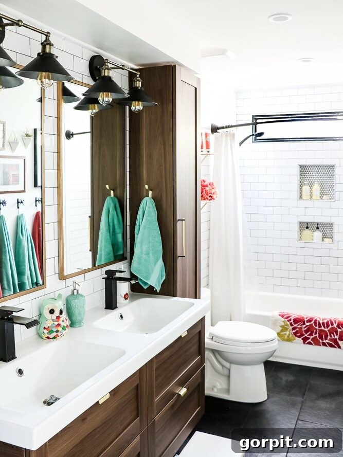 Affordable Bathroom Transformations: Smart DIY Renovation Ideas 17 Updated bathroom shared by young girls, featuring new uniform flooring and a bright, functional design.