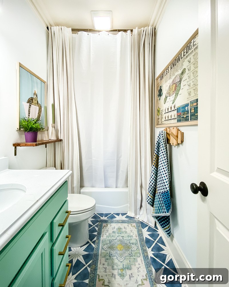 Affordable Bathroom Transformations: Smart DIY Renovation Ideas 21 Girl's blue and green bathroom featuring full-length curtains to elegantly hide an outdated shower.