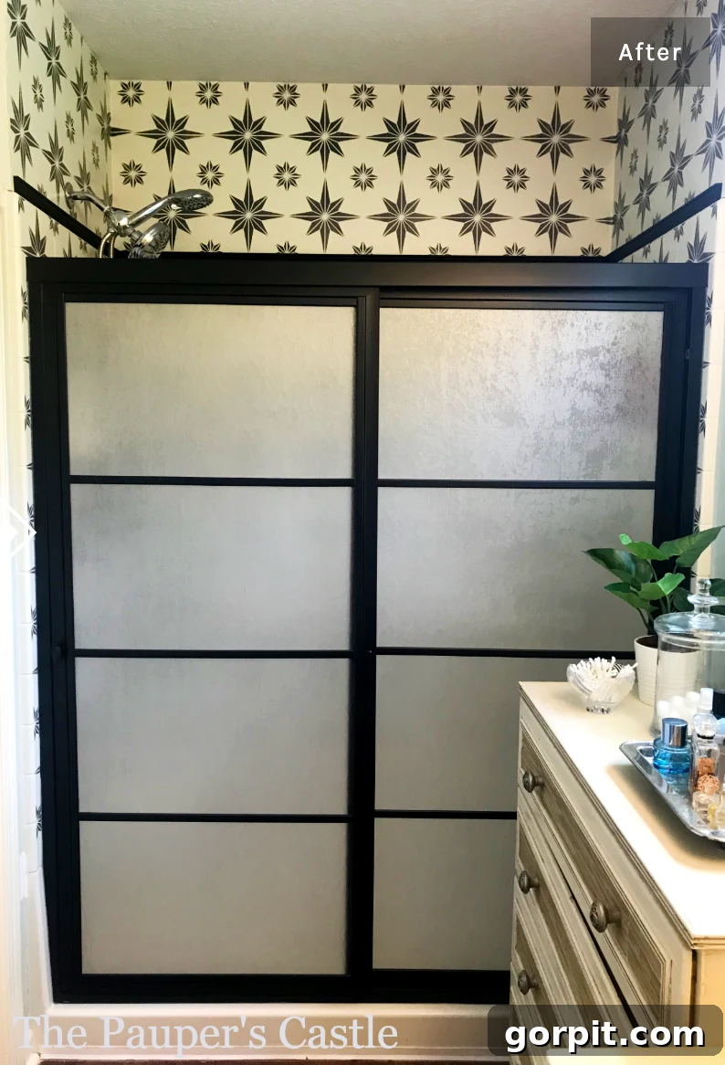 Affordable Bathroom Transformations: Smart DIY Renovation Ideas 23 DIY updated glass shower doors painted black with modern grids added, creating a stylish and contemporary look.
