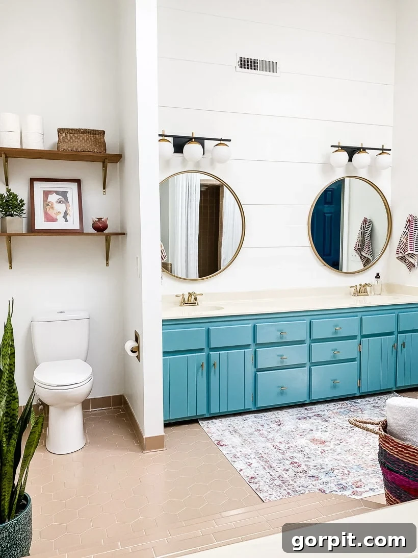 Affordable Bathroom Transformations: Smart DIY Renovation Ideas 27 Master bathroom after an affordable cosmetic makeover, featuring fresh paint, updated decor, and a brighter atmosphere.