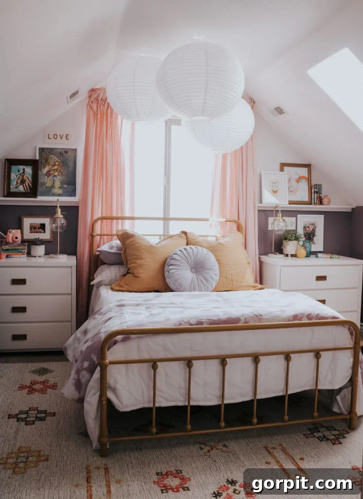 25 Fresh Teen Room Makeover Ideas for Guys and Girls 16 One teen bedroom idea showcases a serene neutral attic bedroom, featuring graceful round paper lanterns suspended from the ceiling above the bed, which is adorned with muted bedding, creating a soft and whimsical ambiance.