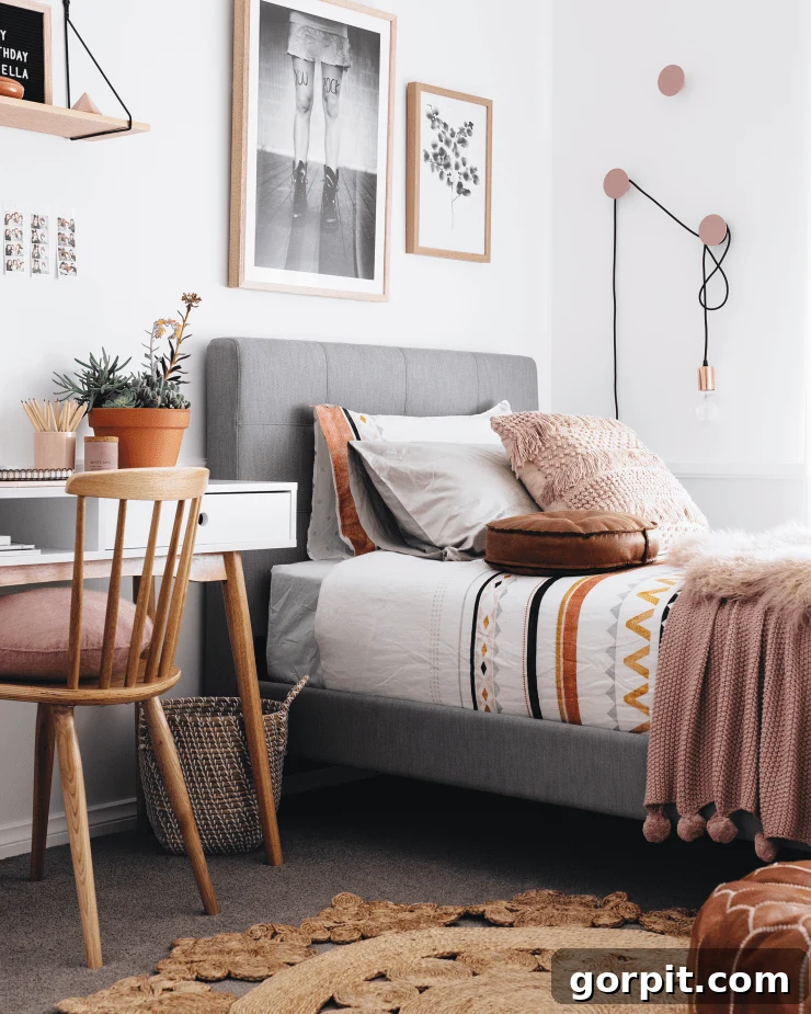 25 Fresh Teen Room Makeover Ideas for Guys and Girls 3 A teen girl bedroom with a sleek desk next to the bed, thoughtfully designed to double as a vanity. The setup is clean and modern, offering both a study area and a beauty station in one cohesive space.