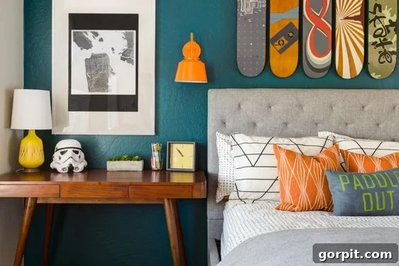 25 Fresh Teen Room Makeover Ideas for Guys and Girls 22 Stylish skateboards hanging prominently above a grey bed in a teen boy's room, complemented by a nightstand holding a lamp and a miniature Stormtrooper's mask, showcasing personalized decor.