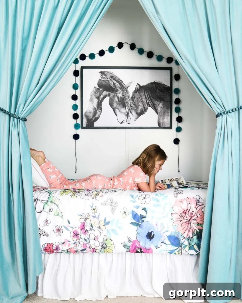 bed in closet framed by curtains in girl's bedroom