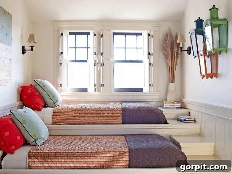 platform beds with striped bed spreads in front of windows