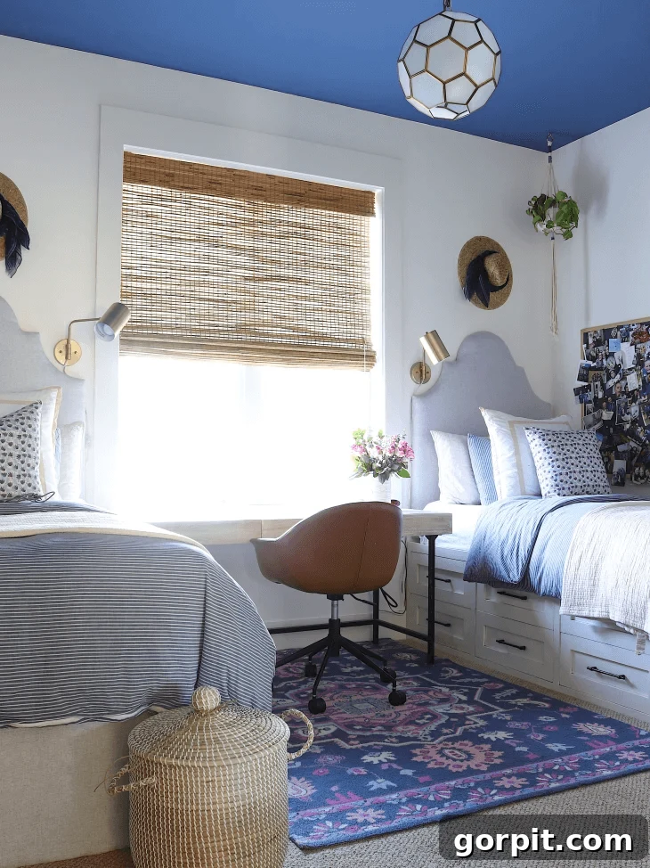shared girls bedroom with drawer storage under beds