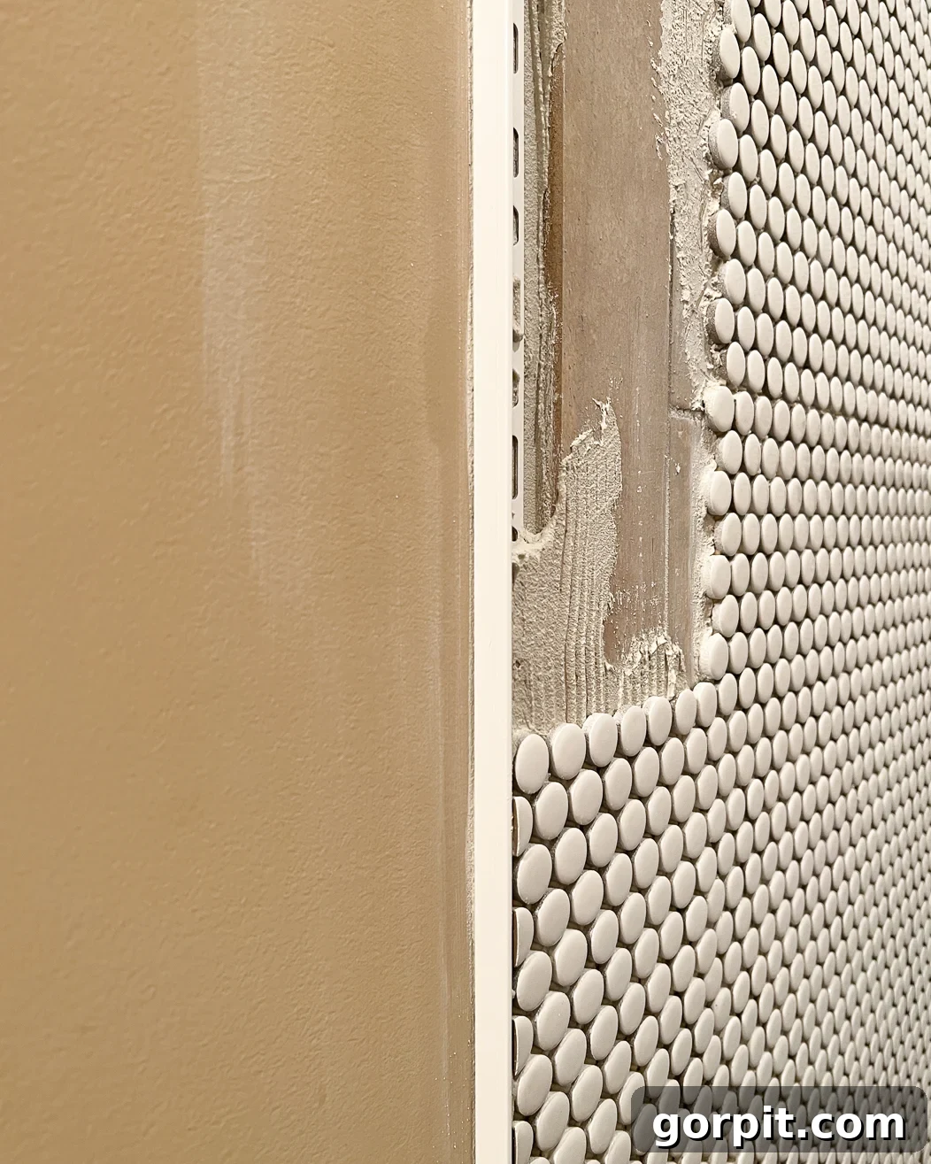 1/2 inch Schluter edge trim piece used to finish the edge of tile over tile installation