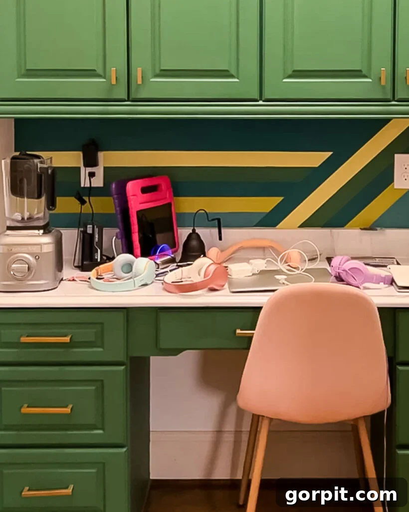 Old, cluttered desk with a small charging station overflowing with electronic devices and tangled cords