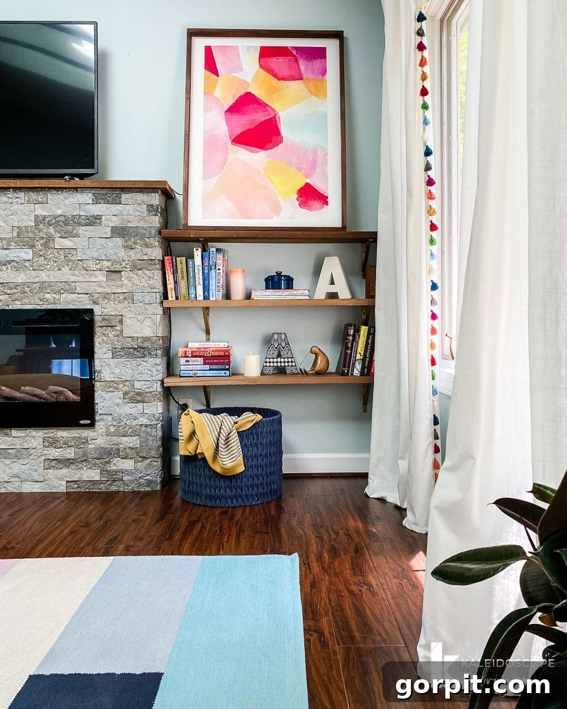 DIY electric fireplace clad with Airstone, showing the installed insert