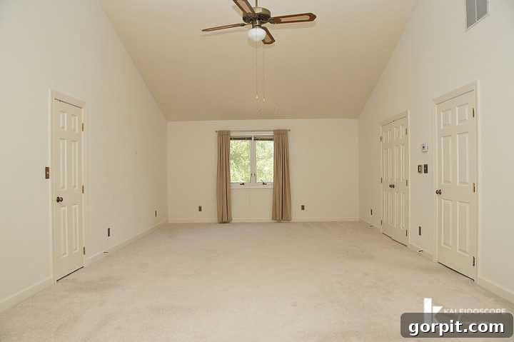 outdated, beige primary bedroom before renovation