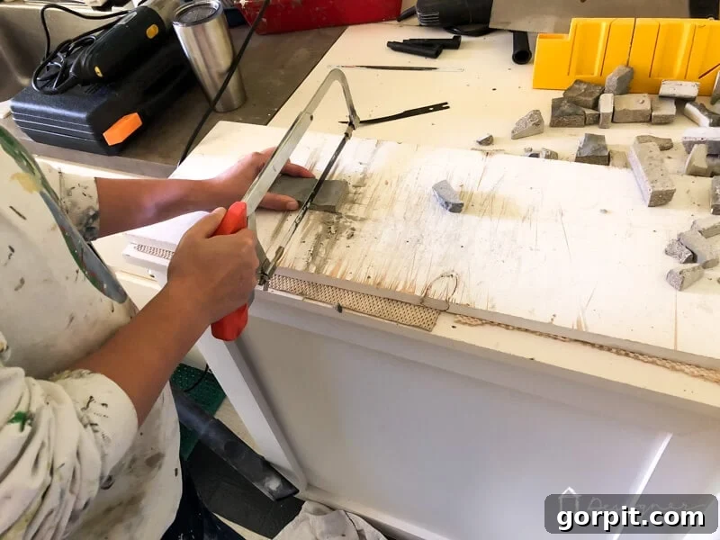 Applying AirStone pieces to the electric fireplace surround
