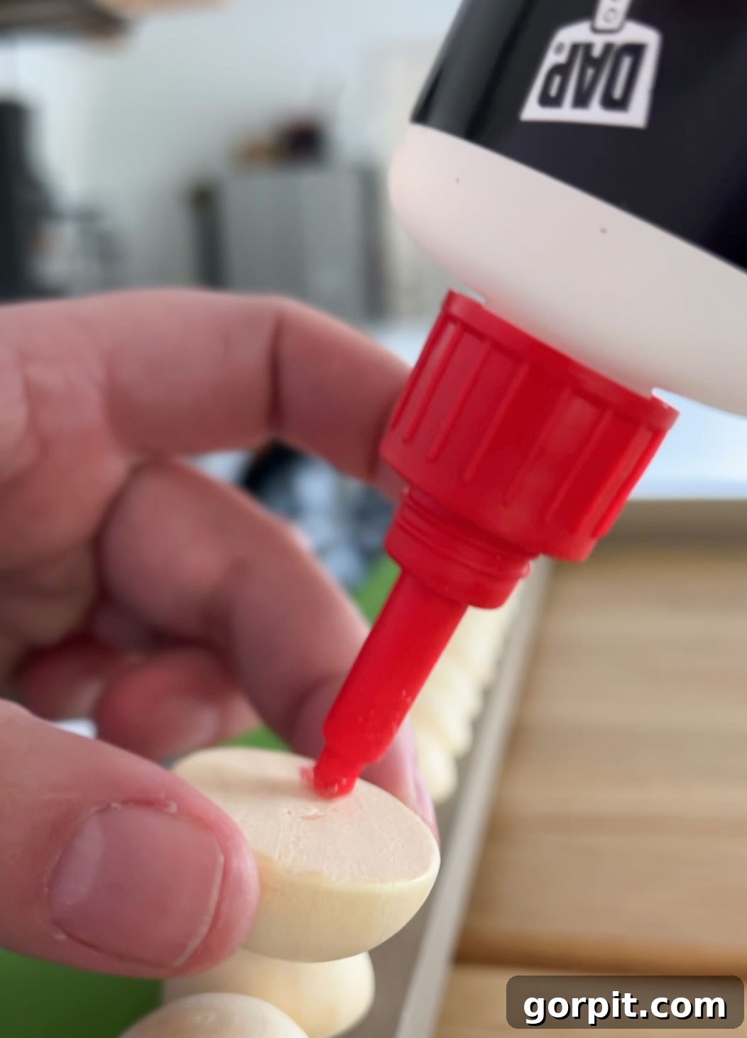 gluing wooden half balls on diy tv frame