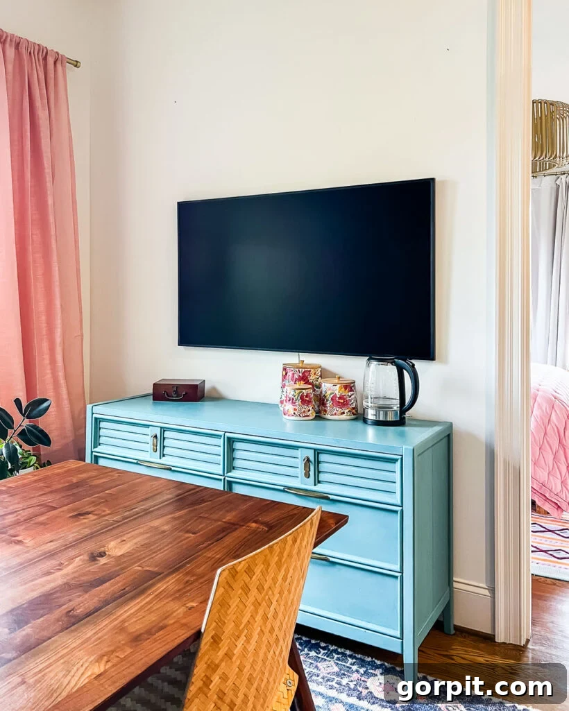 tv mounted on wall without any frame or art