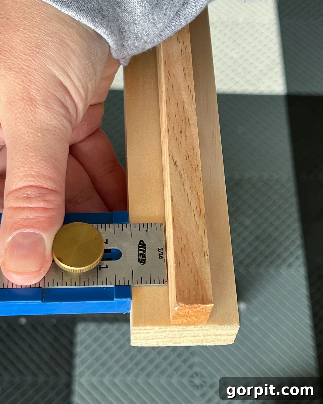 using Kreg measuring gauge tool to determine wood placement for DIY TV frame