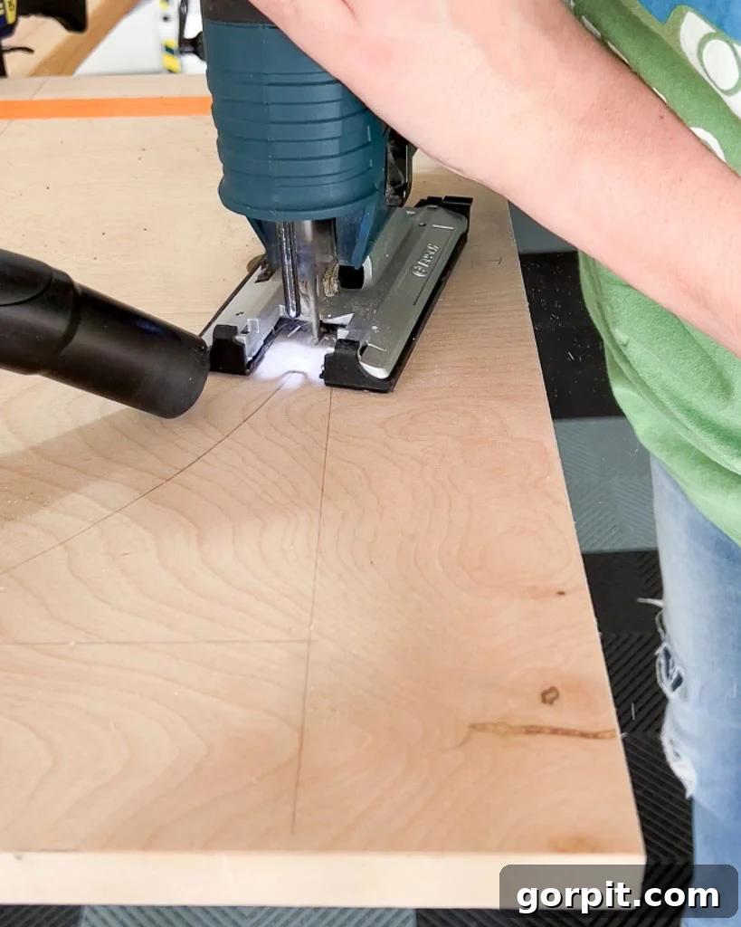 using jigsaw to cut arch out of plywood for DIY dog crate