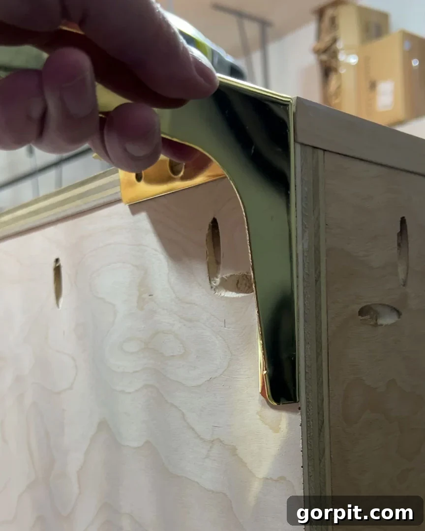 attaching gold furniture legs to DIY wooden dog crate