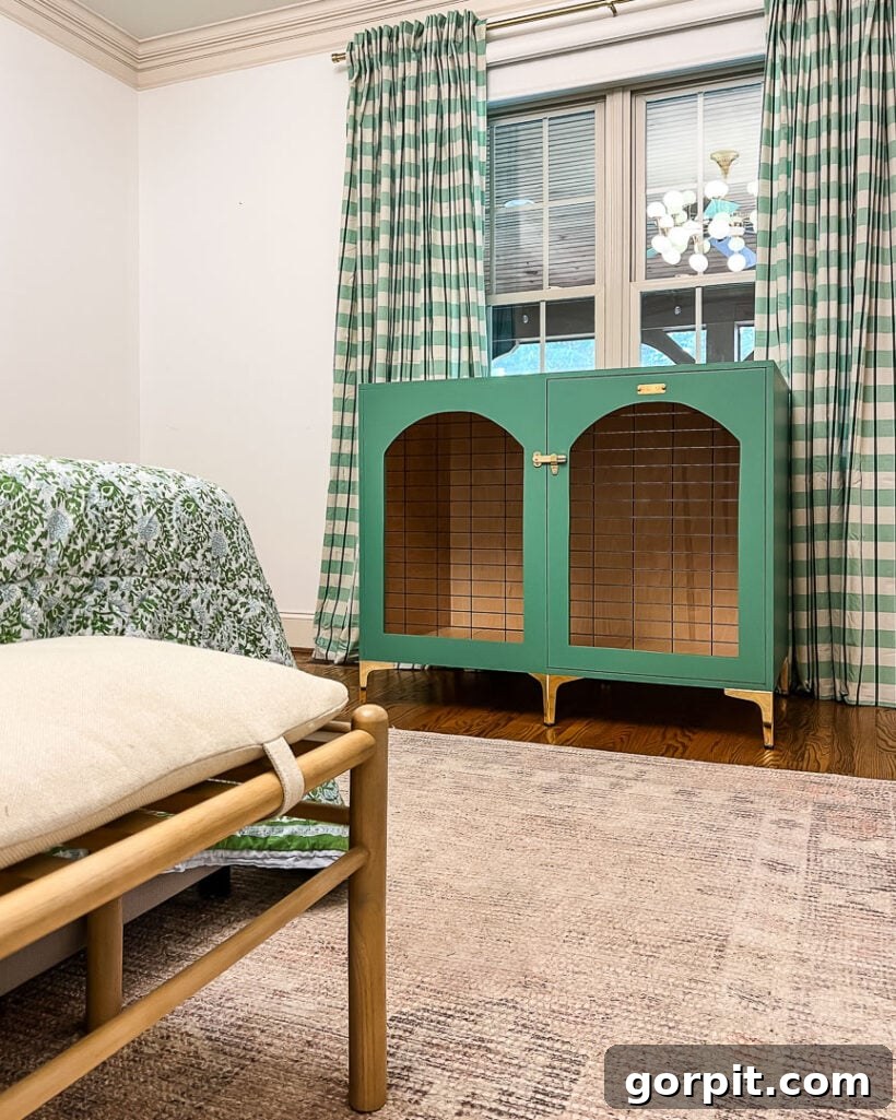 DIY wood dog crate that looks like furniture on display in green bedroom