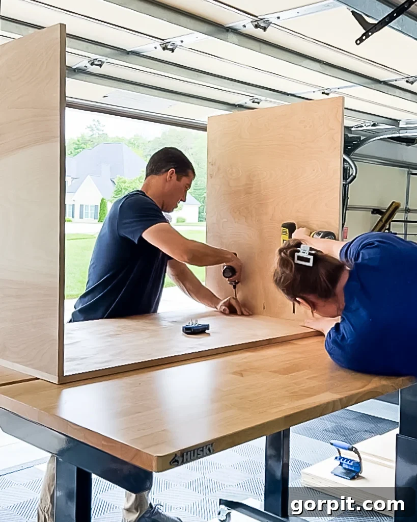man and woman assembling DIY dog crate made from plywood