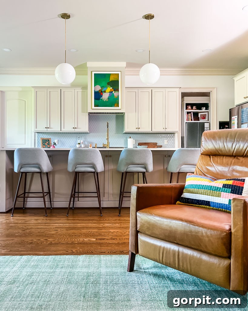 Our Kitchen Renovation Reveal A Perfect Blend of Neutral and Color 12 The newly designed kitchen island with expanded cabinet storage, showcasing a blend of functionality and style.
