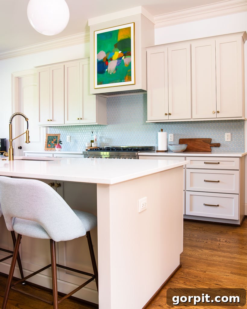 Our Kitchen Renovation Reveal A Perfect Blend of Neutral and Color 9 A beautifully renovated kitchen with vast counter space and modern appliances, ready for entertaining.