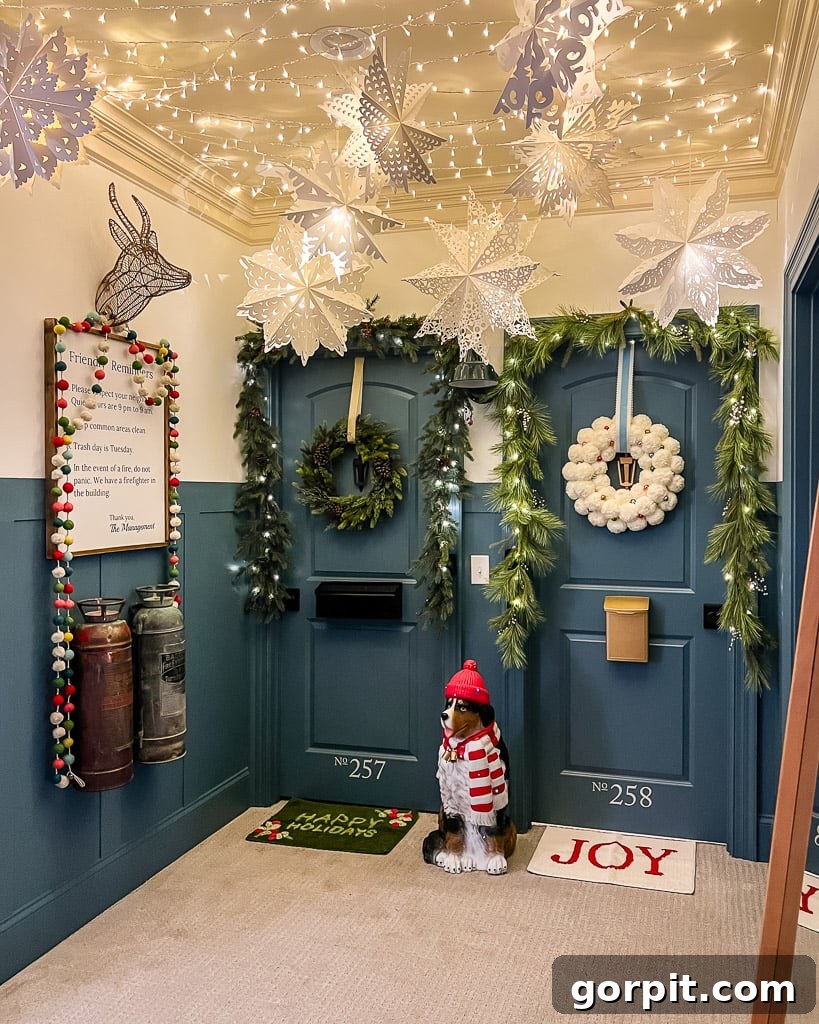 Large, glowing paper snowflake lanterns suspended from the ceiling in a hallway, adding a festive and magical touch to Christmas decorations.